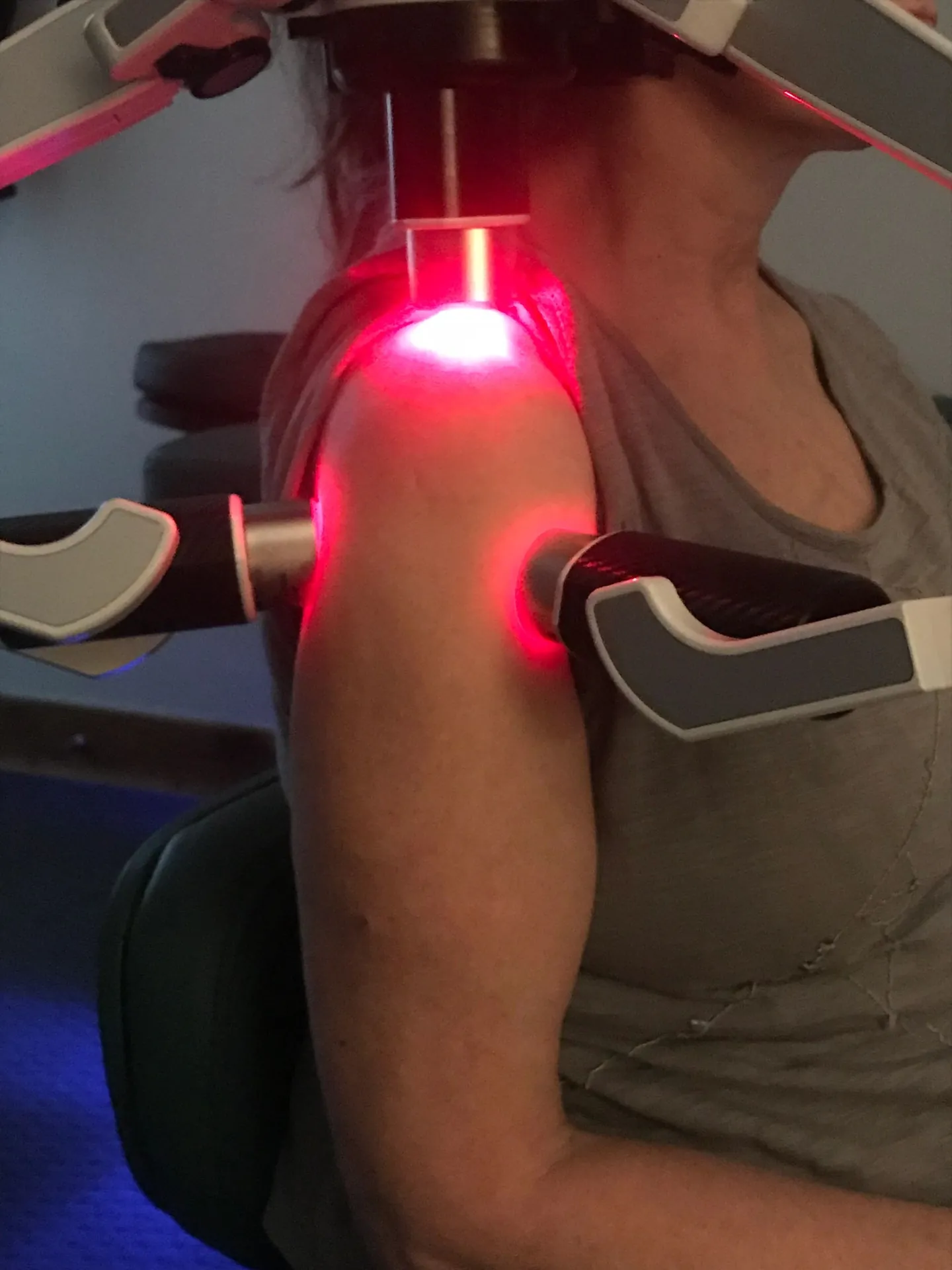 Red light therapy applied to a patient's shoulder during a visit at Durango Spine + Sport